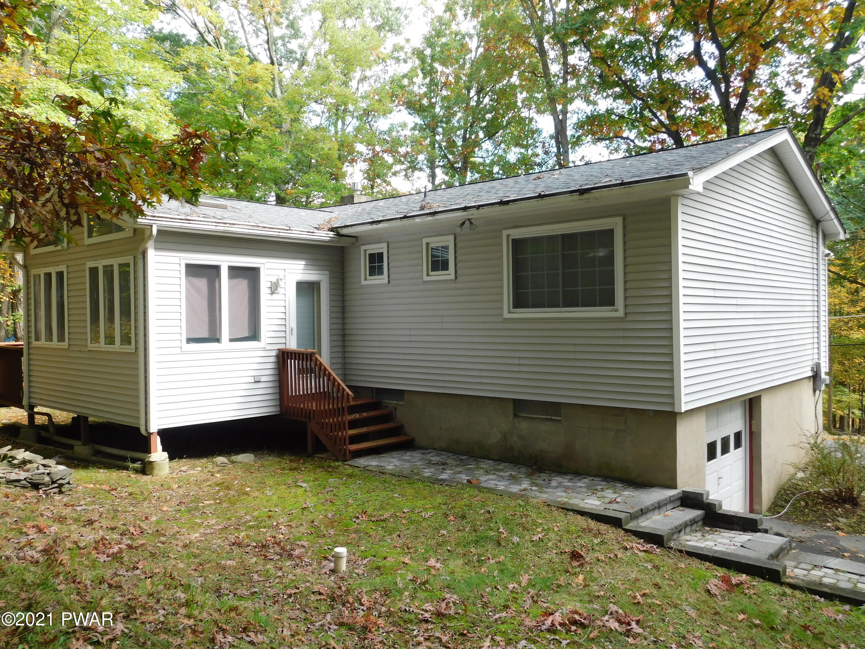 119 Ridge Drive Milford, PA 18337 - Photo 3 of 40 a view of a house with a yard and wooden fence