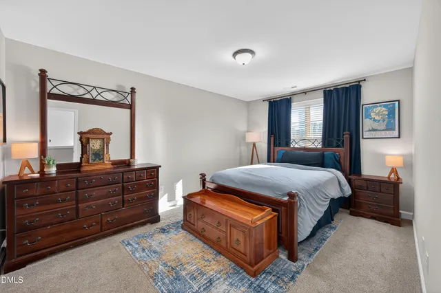 a bedroom with furniture and a book shelf