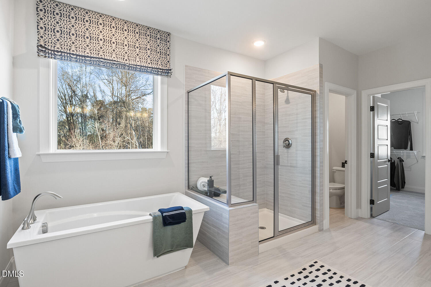 8120 Andrea Lane Raleigh, NC 27613 - Photo 12 of 25 a bathroom with a tub a sink and glass door