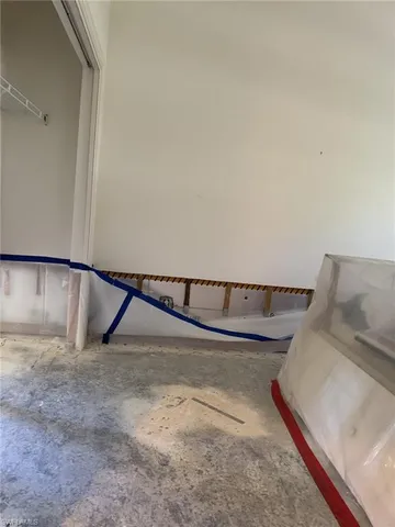 a view of a room with window and stairs