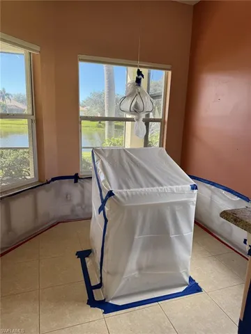 a view of kitchen with cabinets and outdoor space