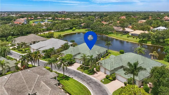 a view of a house with a yard and a garden