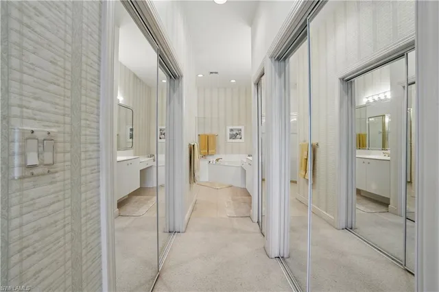 a bathroom with a sink a mirror and a shower