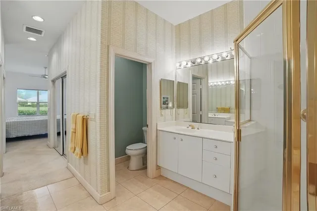 a view of a balcony with a floor to ceiling window next to a road