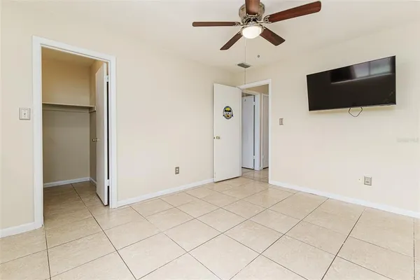a view of a livingroom with an empty space and a flat screen tv