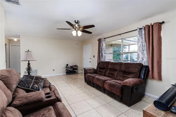 a living room with furniture and a large window