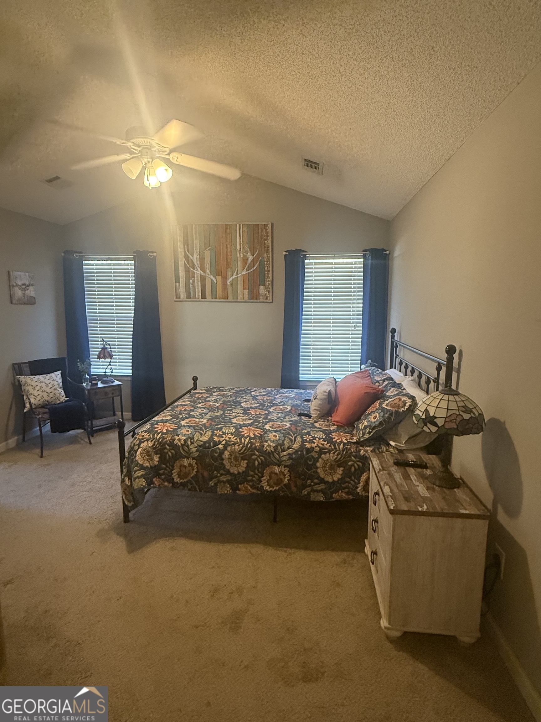 340 Harris Avenue Locust Grove, GA 30248 - Photo 15 of 24 a bedroom with a bed and a cabinets