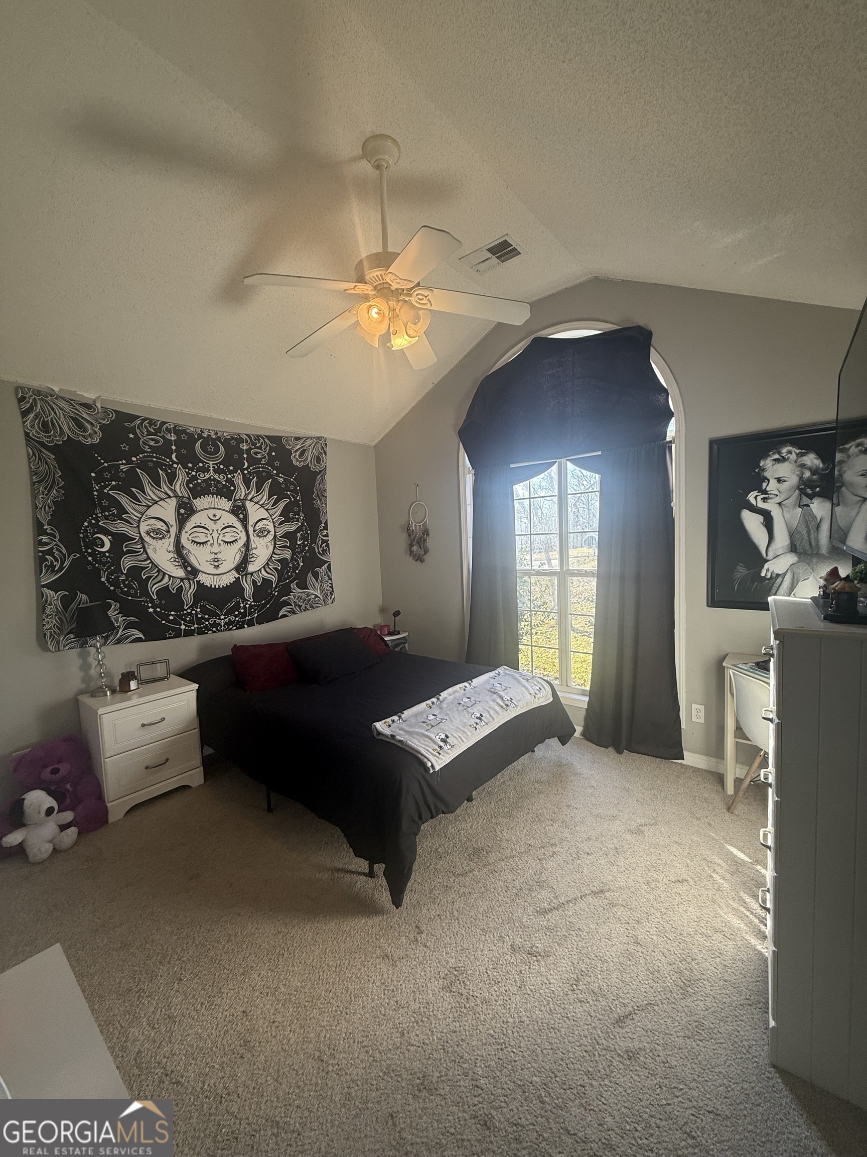 340 Harris Avenue Locust Grove, GA 30248 - Photo 16 of 24 a living room with furniture and a chandelier
