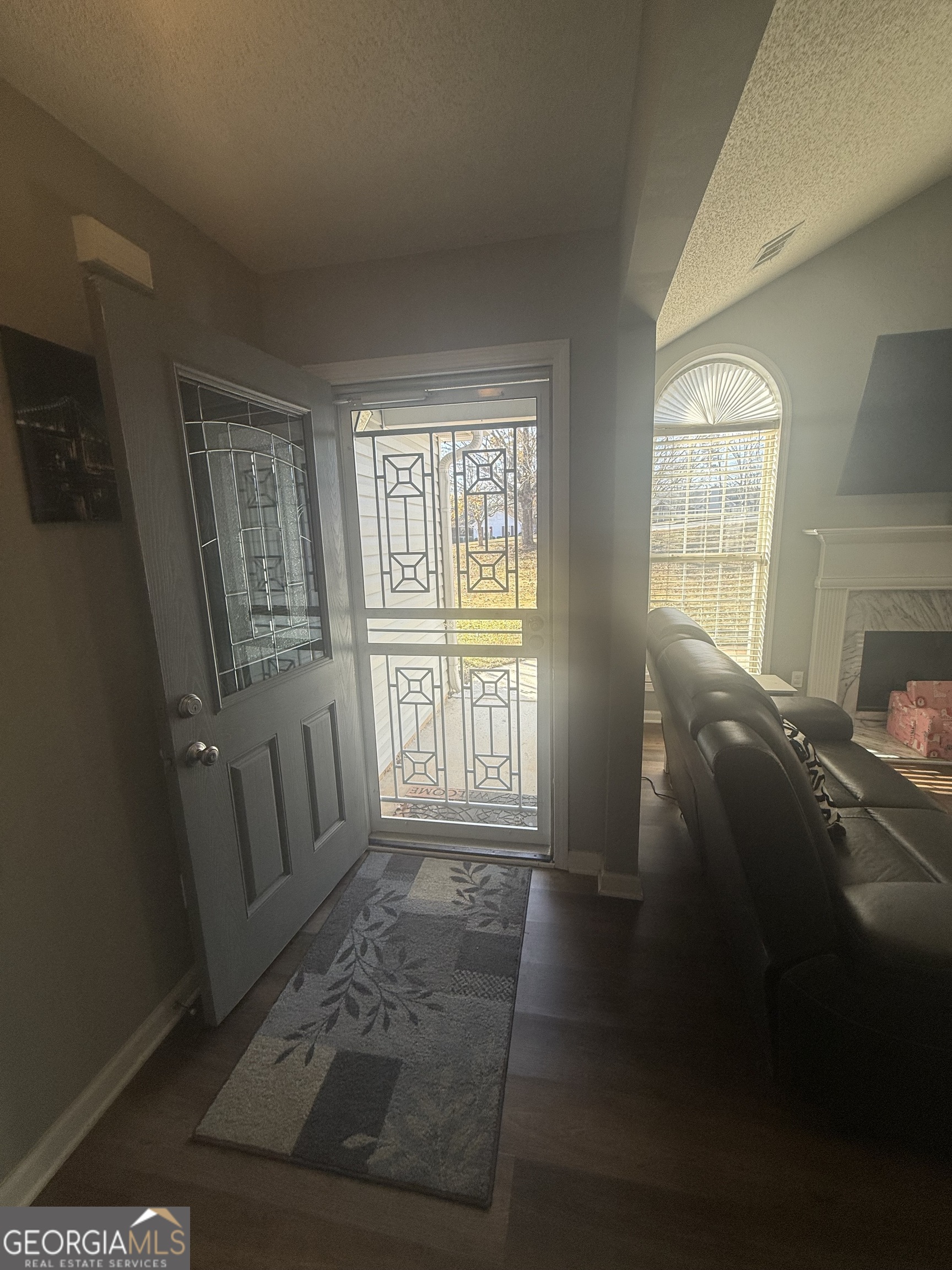 340 Harris Avenue Locust Grove, GA 30248 - Photo 19 of 24 a view of an empty room with wooden floor and a window