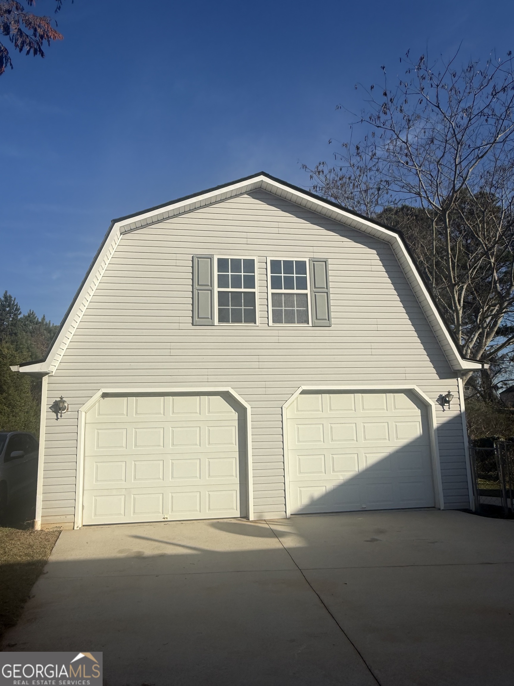 340 Harris Avenue Locust Grove, GA 30248 - Photo 20 of 24 a view of an empty room with a large window