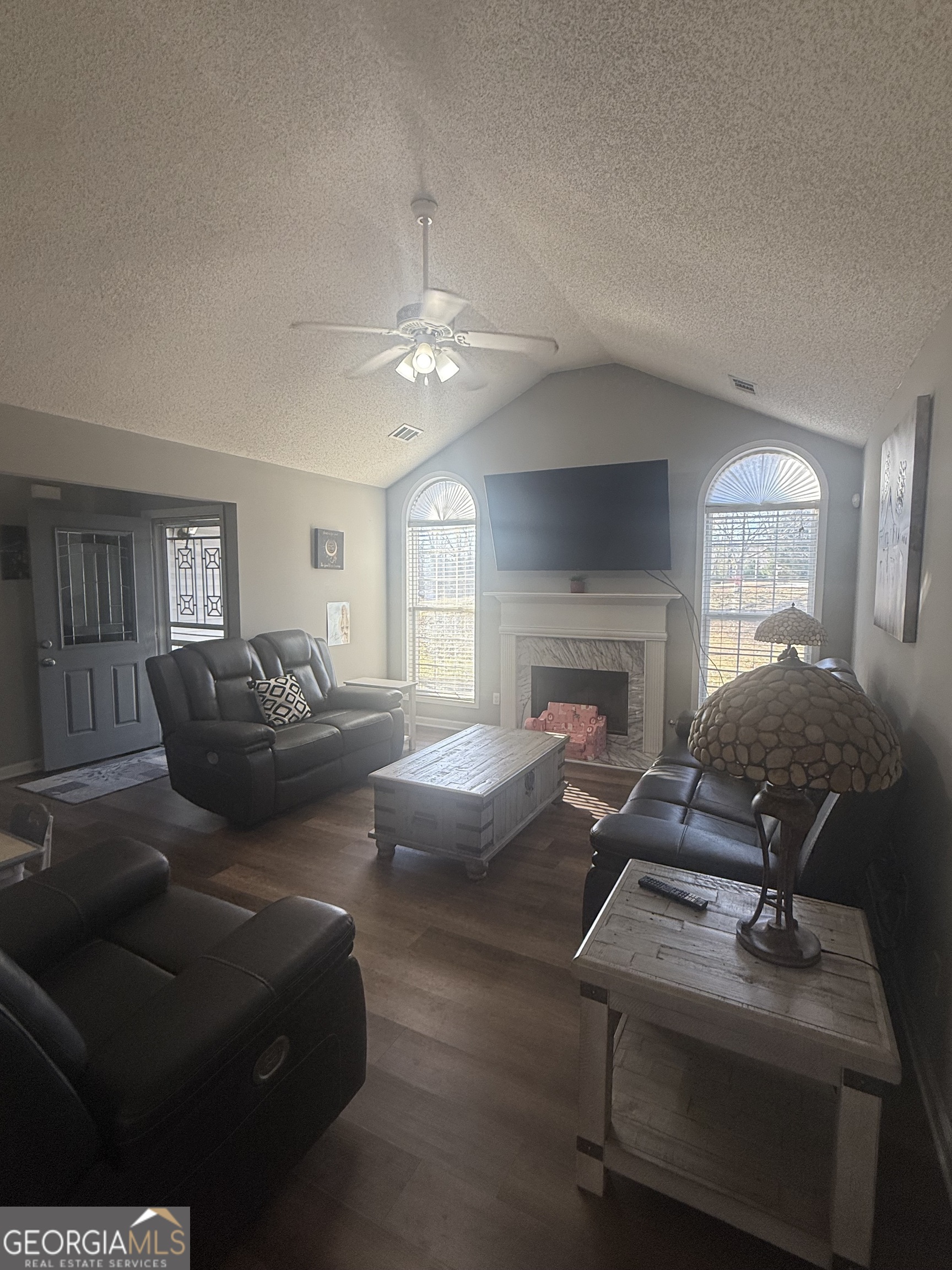 340 Harris Avenue Locust Grove, GA 30248 - Photo 2 of 24 a living room with furniture fireplace and a window