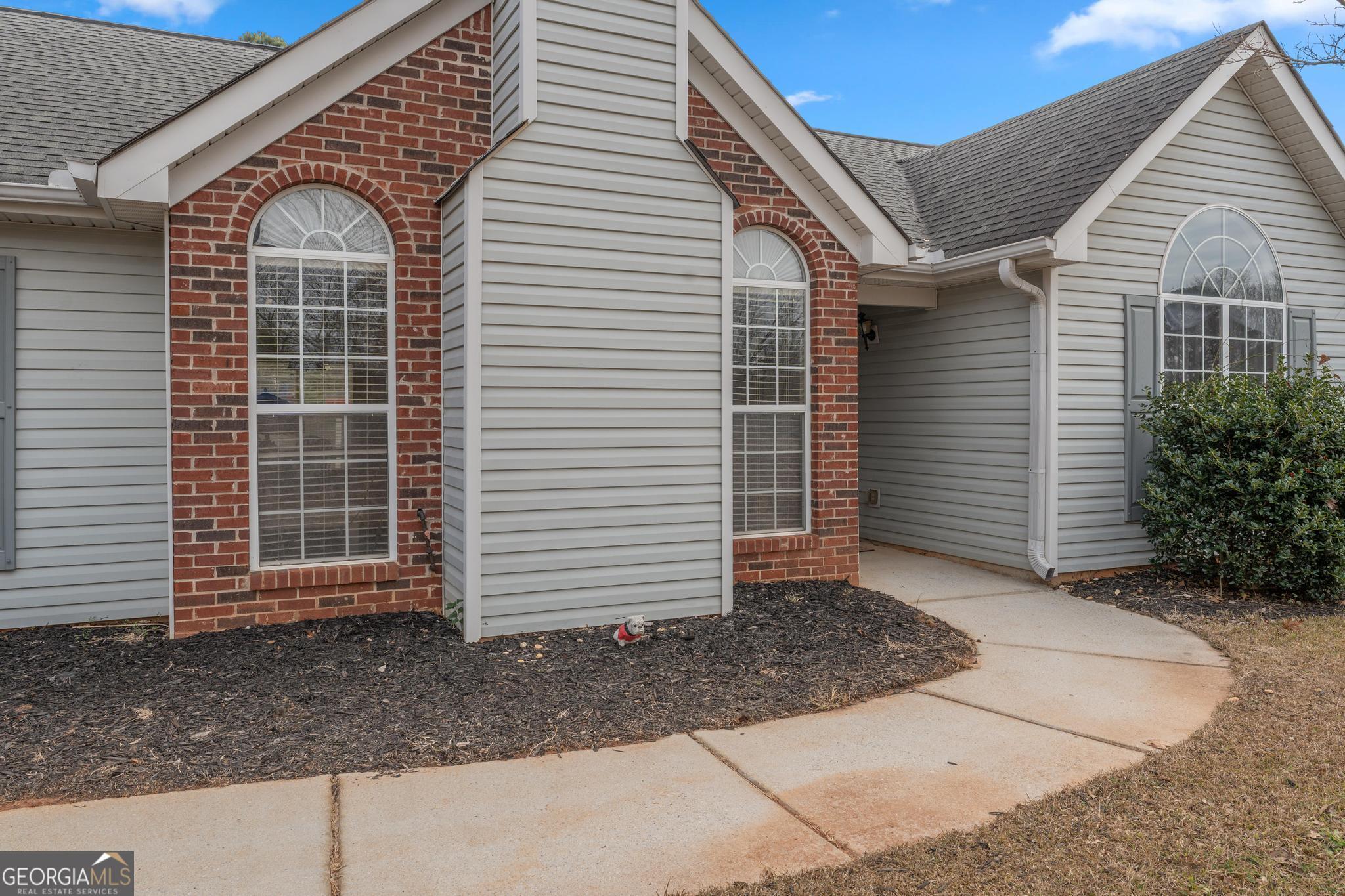 340 Harris Avenue Locust Grove, GA 30248 - Photo 2 of 41 a front view of a house with a yard