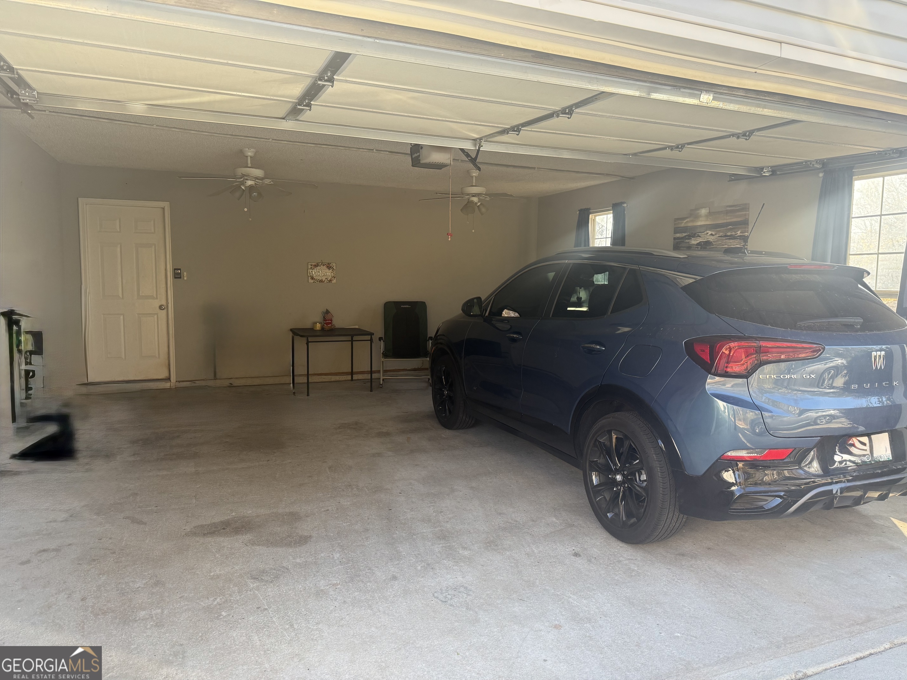 340 Harris Avenue Locust Grove, GA 30248 - Photo 22 of 24 a car parked in a garage