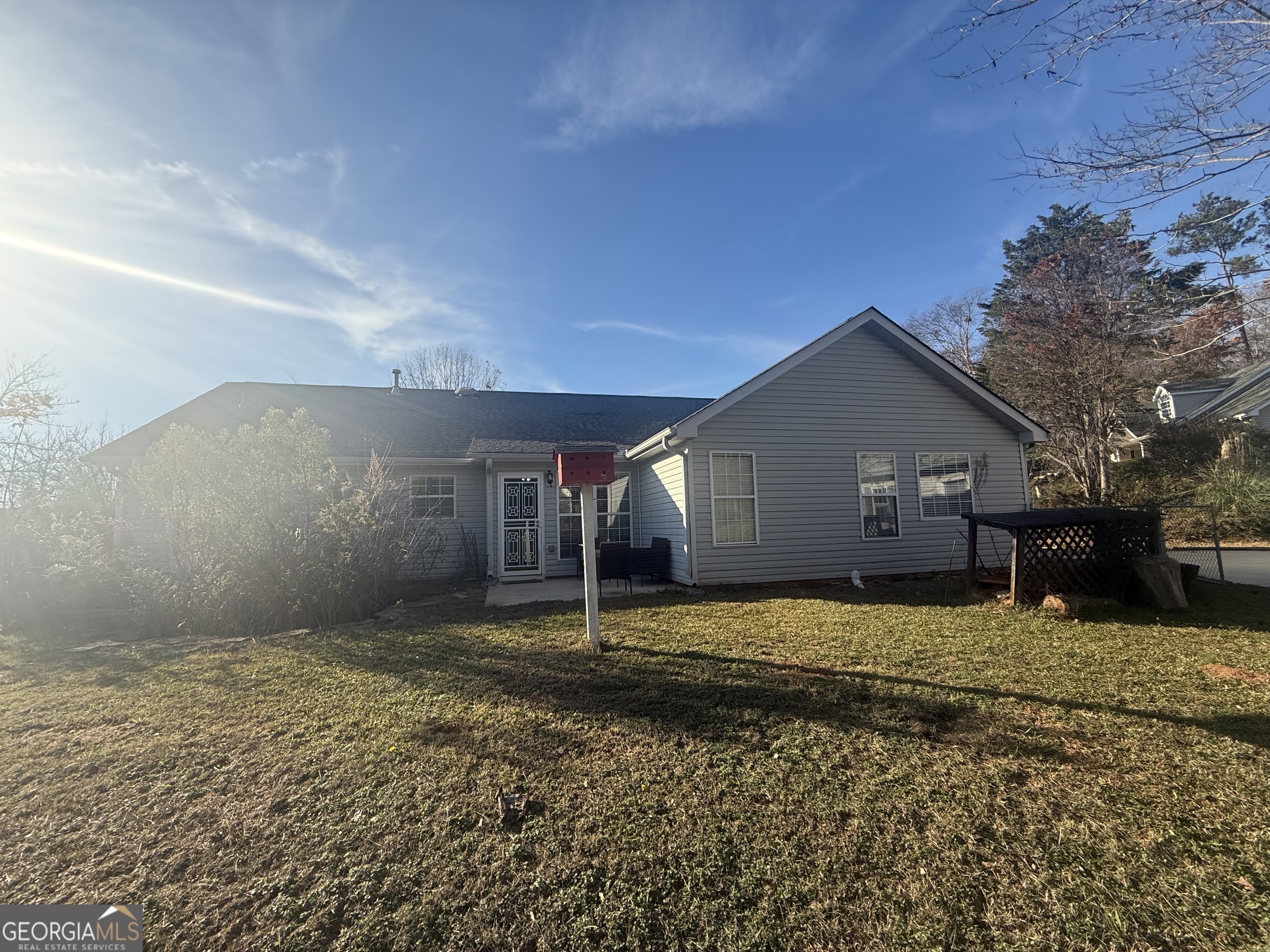340 Harris Avenue Locust Grove, GA 30248 - Photo 23 of 24 a house view with a backyard space