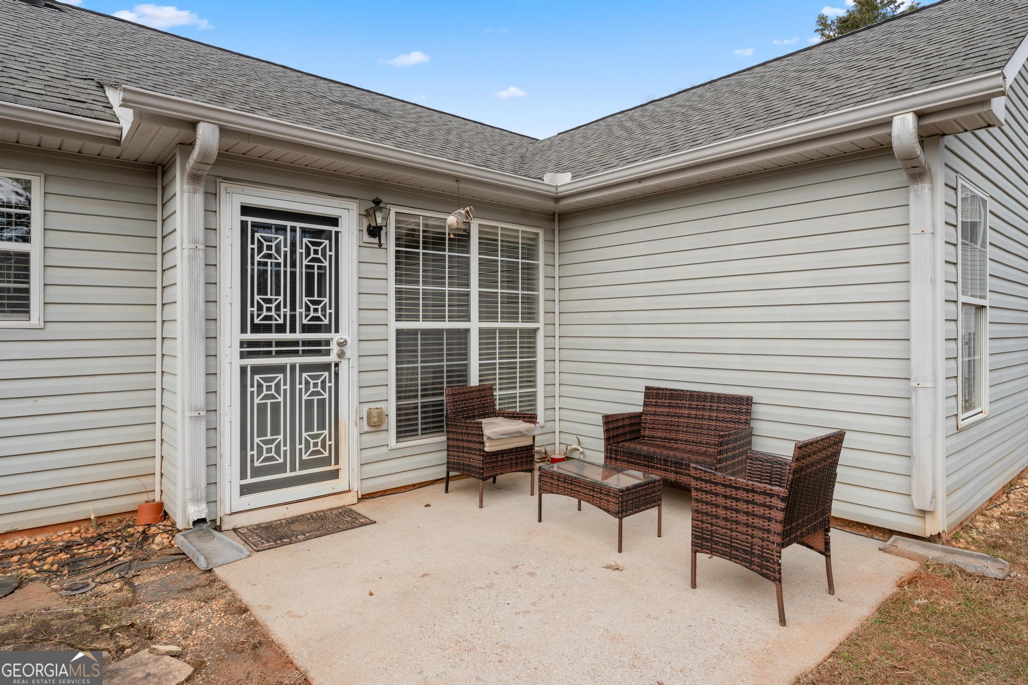 340 Harris Avenue Locust Grove, GA 30248 - Photo 33 of 41 a backyard of a house with table and chairs