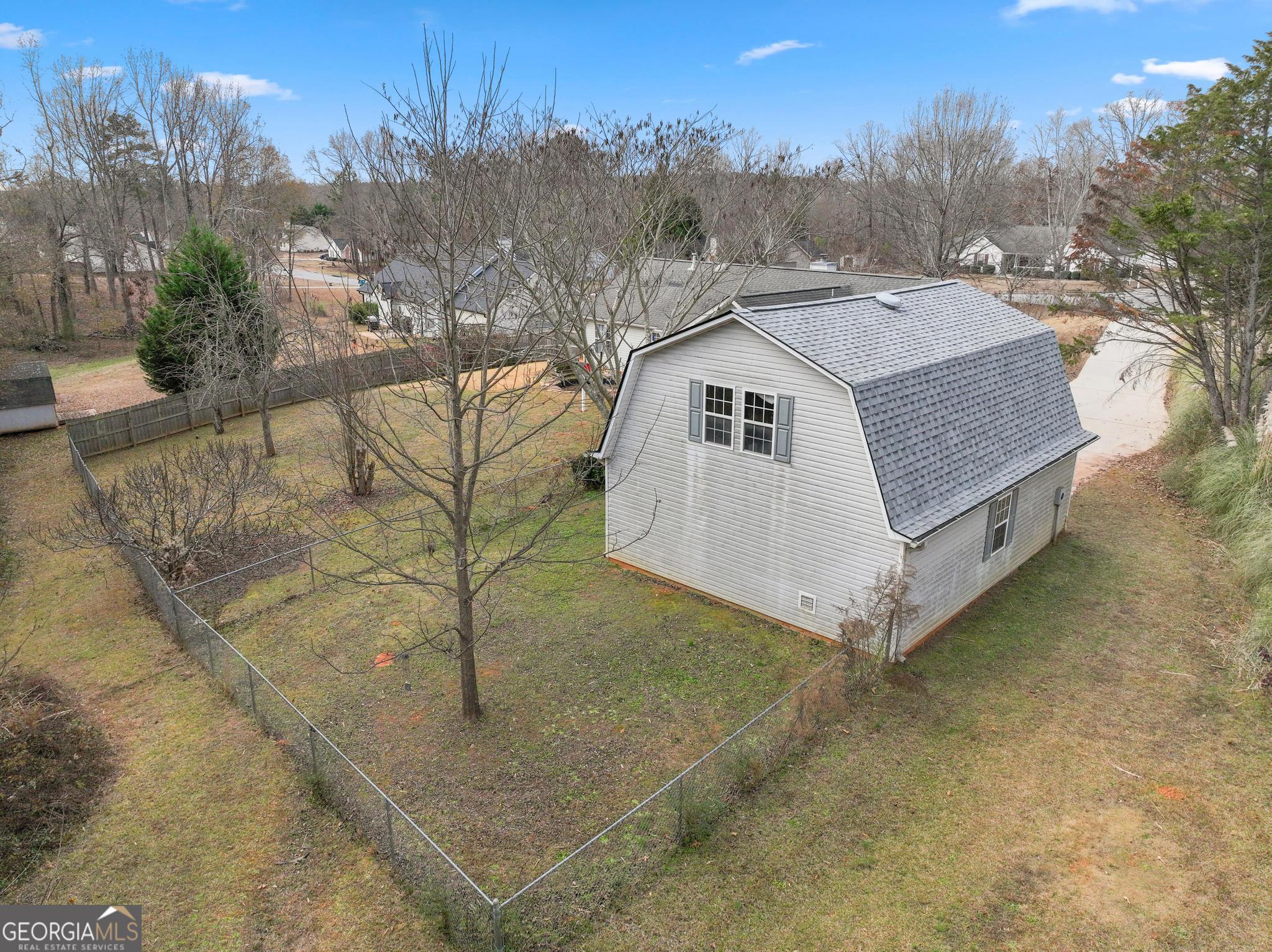 340 Harris Avenue Locust Grove, GA 30248 - Photo 40 of 41 a view of a white house with a yard and sitting area