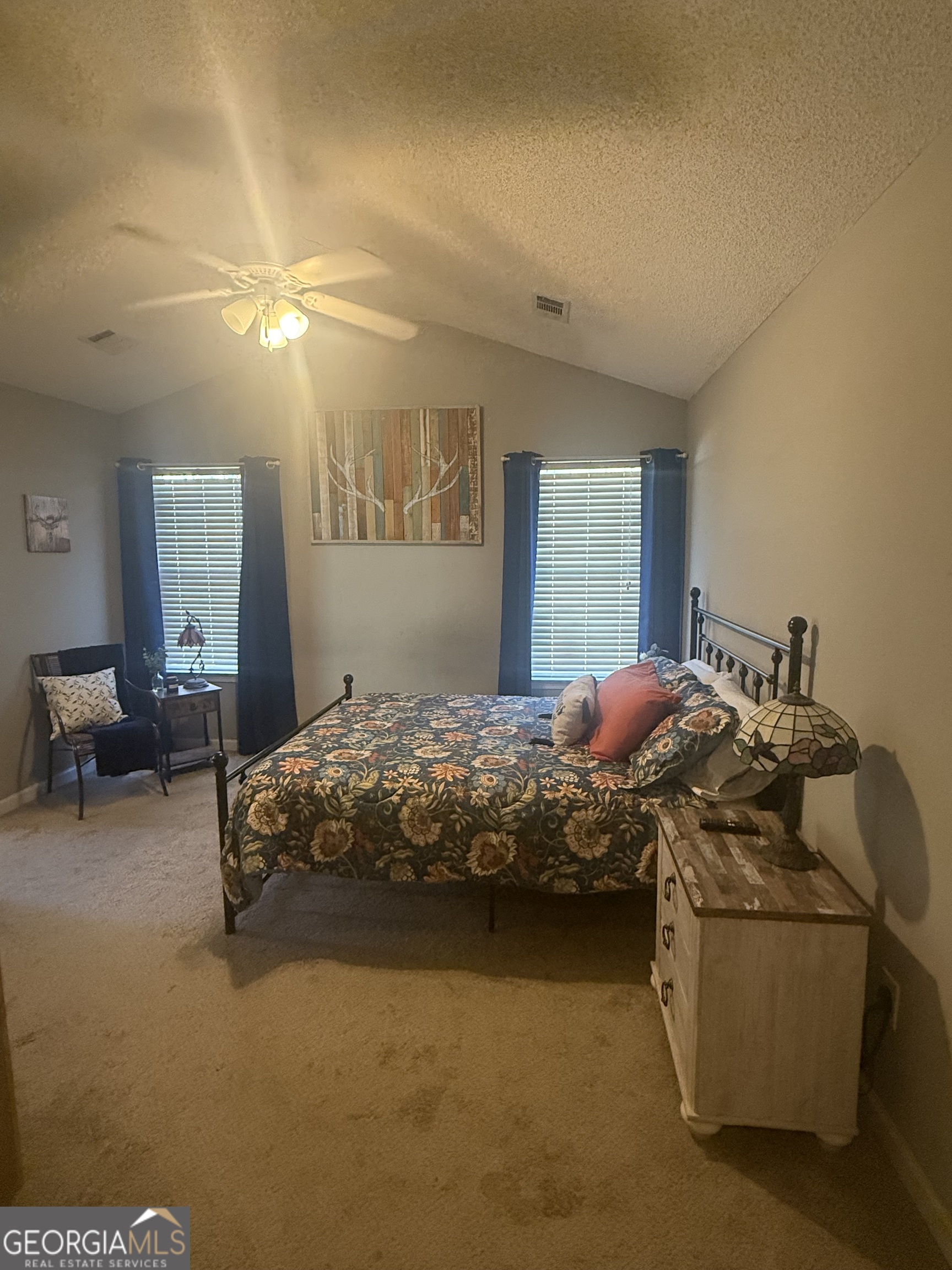 340 Harris Avenue Locust Grove, GA 30248 - Photo 8 of 24 a bedroom with bed and window