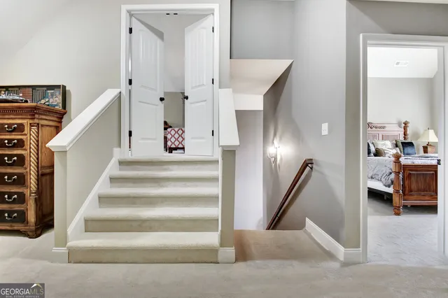 a view of a patio with table and chairs and wooden floor