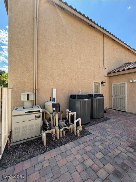 420 Rhythm Street Henderson, NV 89074 - Photo 21 of 27 View of property exterior featuring stucco siding and a patio