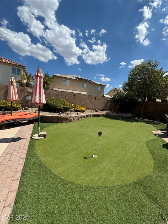 420 Rhythm Street Henderson, NV 89074 - Photo 24 of 27 Fenced backyard featuring a putting area
