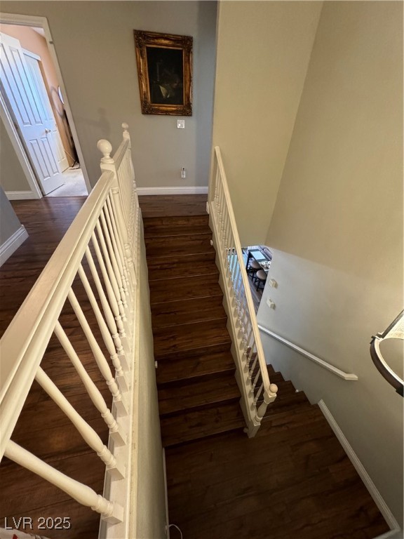 420 Rhythm Street Henderson, NV 89074 - Photo 9 of 27 Stairway with baseboards and wood finished floors