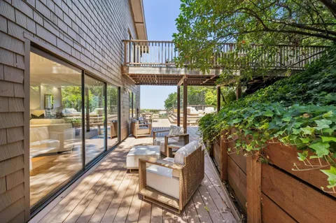 a view of a roof deck with couches