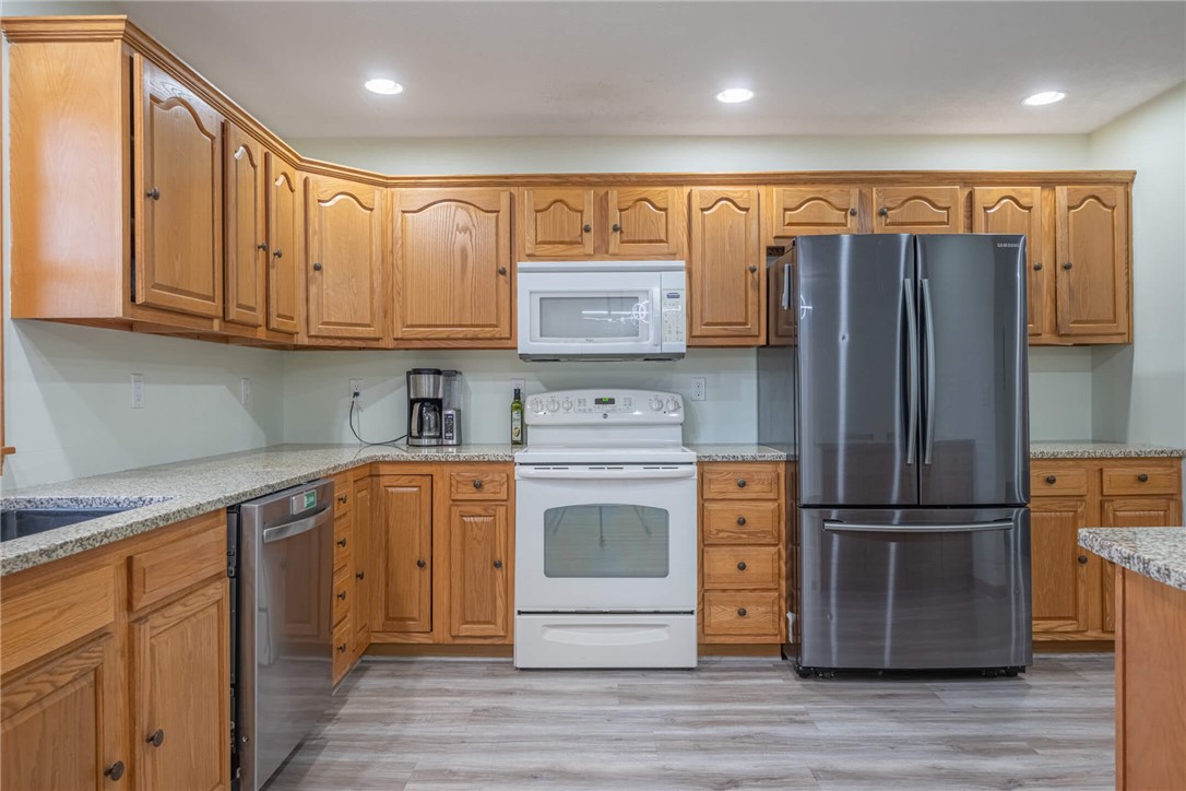 2645 Vance Road St. Paris, OH 43072 - Photo 10 of 35 A well-appointed kitchen features ample cabinetry, durable countertops, and modern appliances, perfect for daily culinary endeavors.