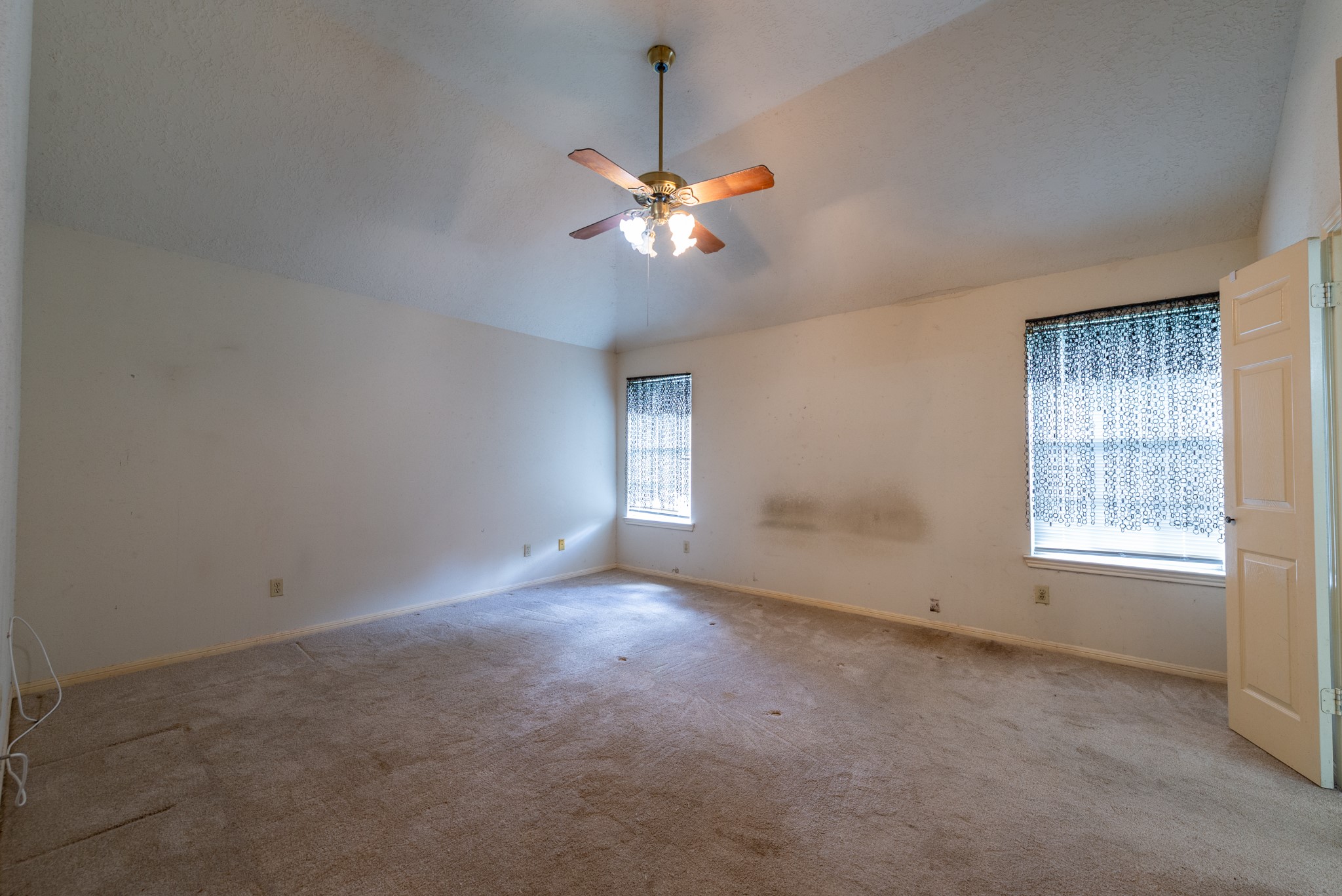 12203 Canterhurst Way Houston, TX 77065 - Photo 18 of 23 a view of an empty room with a window