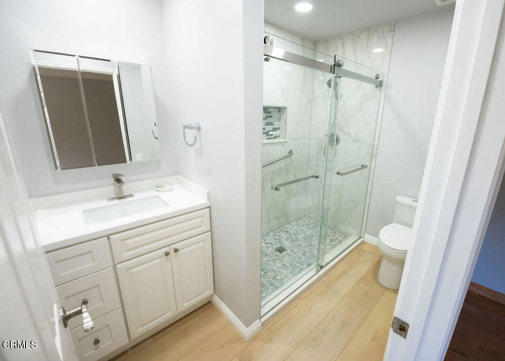 691 Springfield Avenue Ventura, CA 93004 - Photo 16 of 30 a bathroom with a shower sink and mirror
