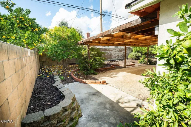 a view of a backyard with a patio