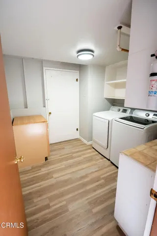 a room with a bed and cabinets