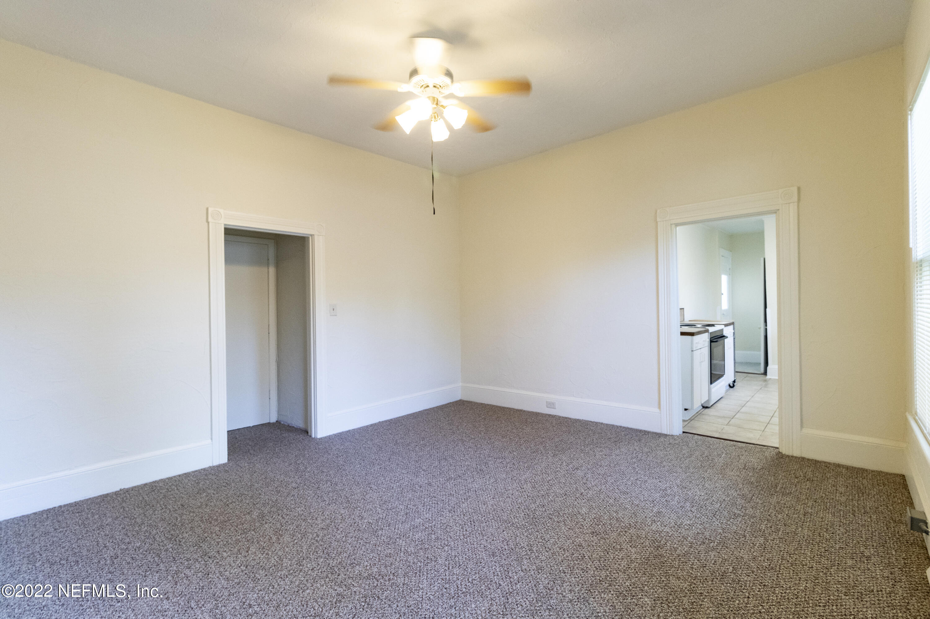 24 Riberia Street, Unit B St. Augustine, FL 32084 - Photo 11 of 19 a view of an empty room with a chandelier fan