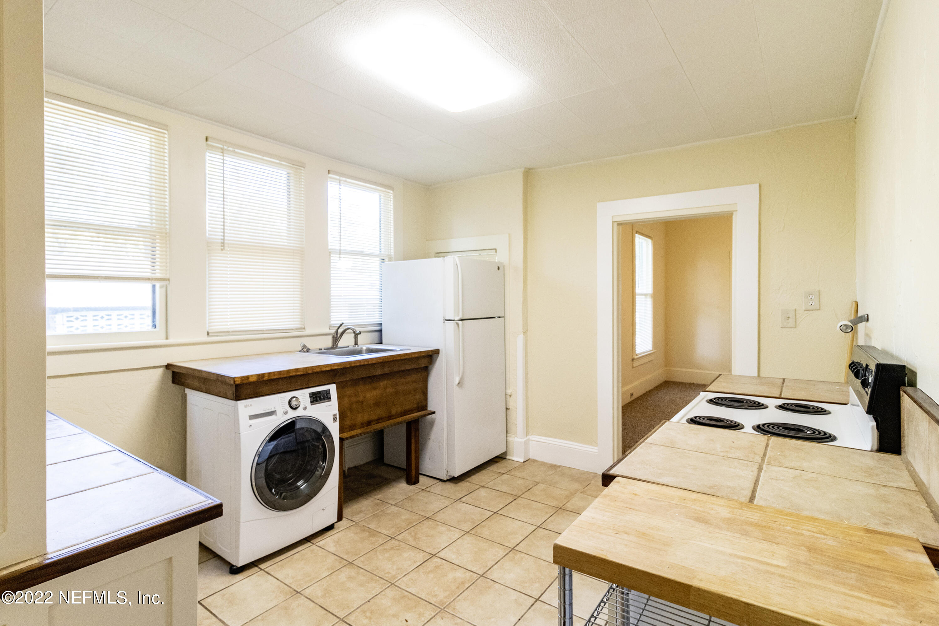 24 Riberia Street, Unit B St. Augustine, FL 32084 - Photo 16 of 19 a room with storage and utility