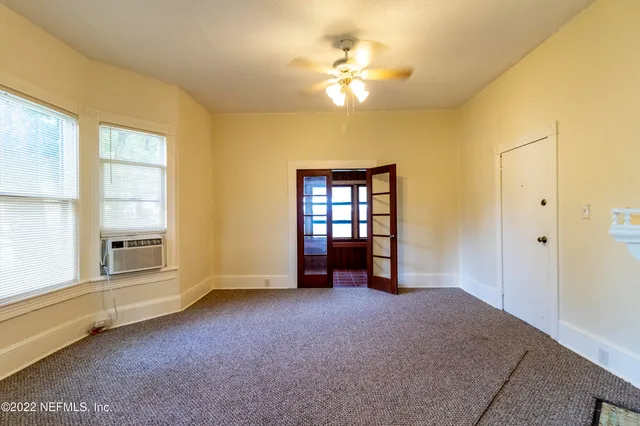 a view of a door and wooden floor