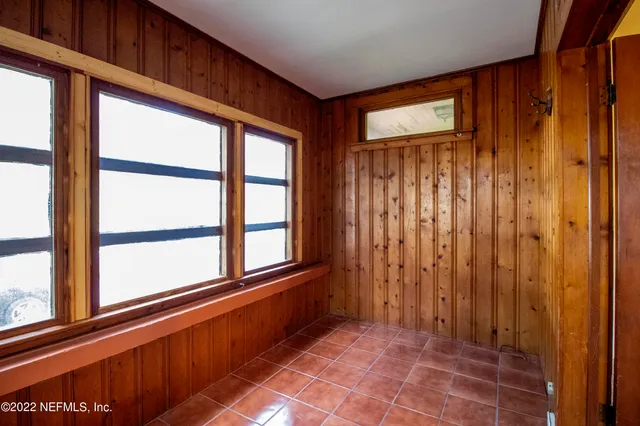 a view of a room with a large window