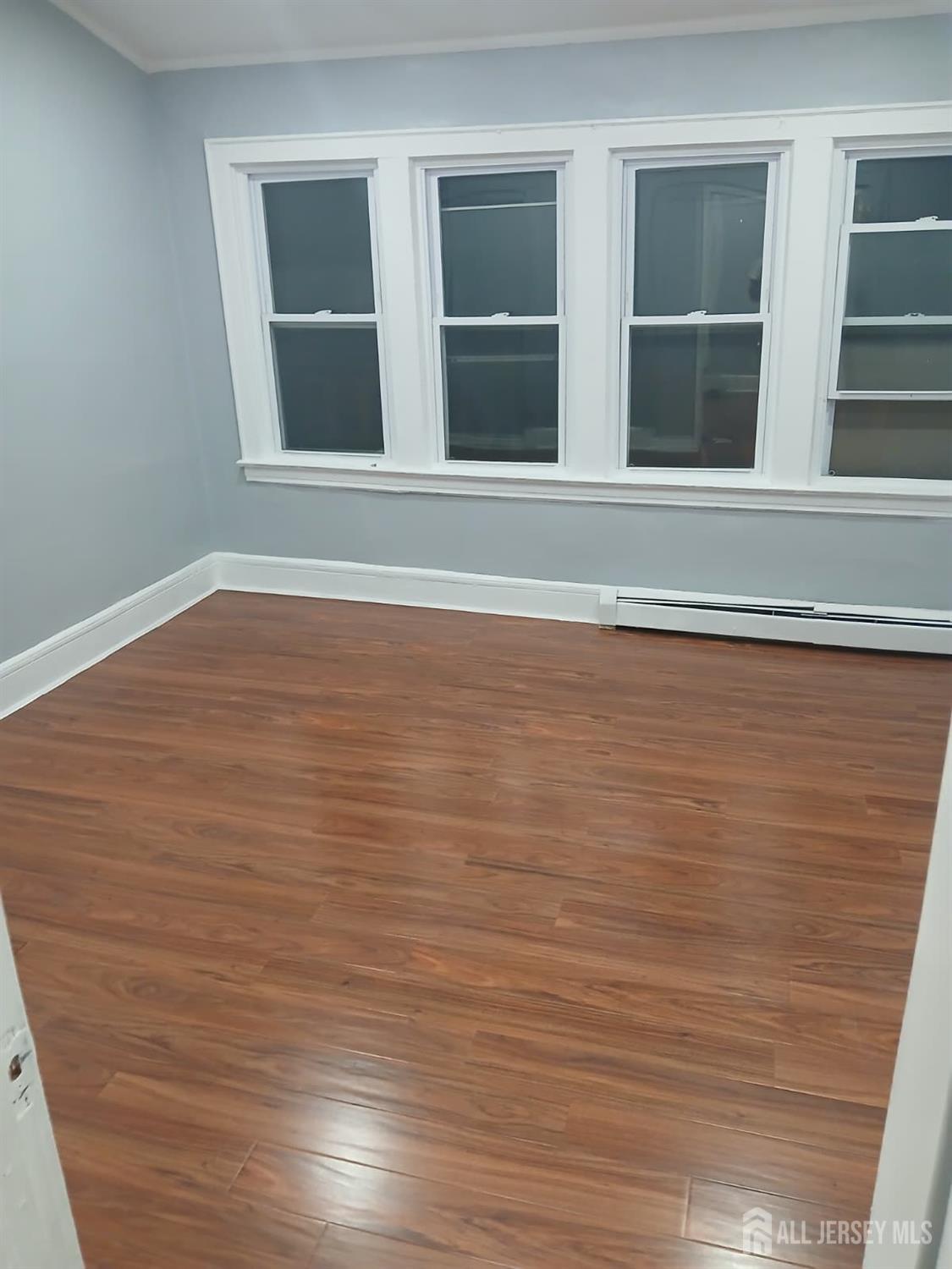 51 Poe Avenue, Unit 3 Newark, NJ 07106 - Photo 6 of 14 a view of an empty room with a window