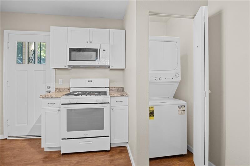 246 Dunseith Street Pittsburgh, PA 15213 - Photo 13 of 28 a kitchen with a stove and a microwave