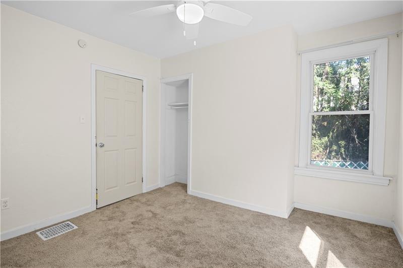 246 Dunseith Street Pittsburgh, PA 15213 - Photo 18 of 28 an empty room with windows and closet