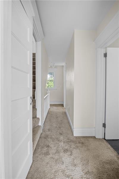 246 Dunseith Street Pittsburgh, PA 15213 - Photo 21 of 28 a view of a hallway with wooden floor and closet area