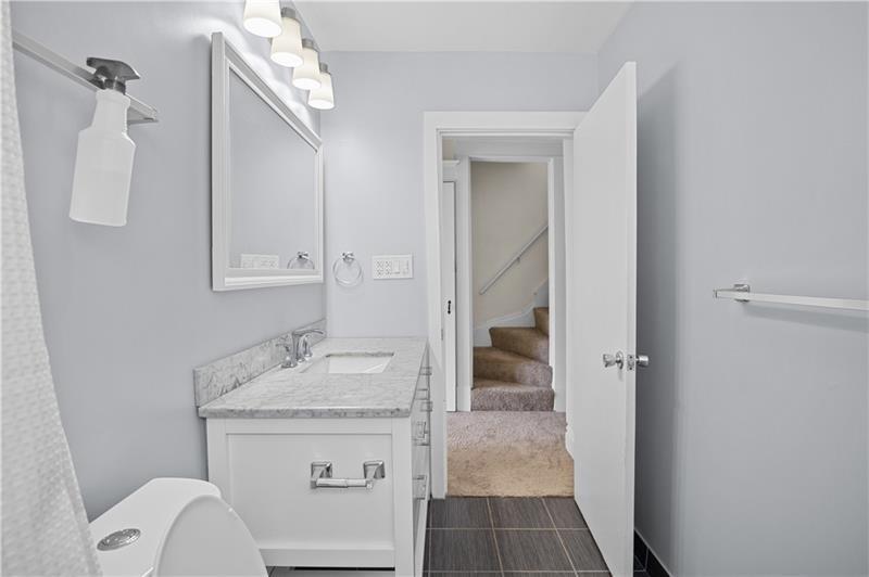 246 Dunseith Street Pittsburgh, PA 15213 - Photo 25 of 28 a bathroom with a sink toilet and shower