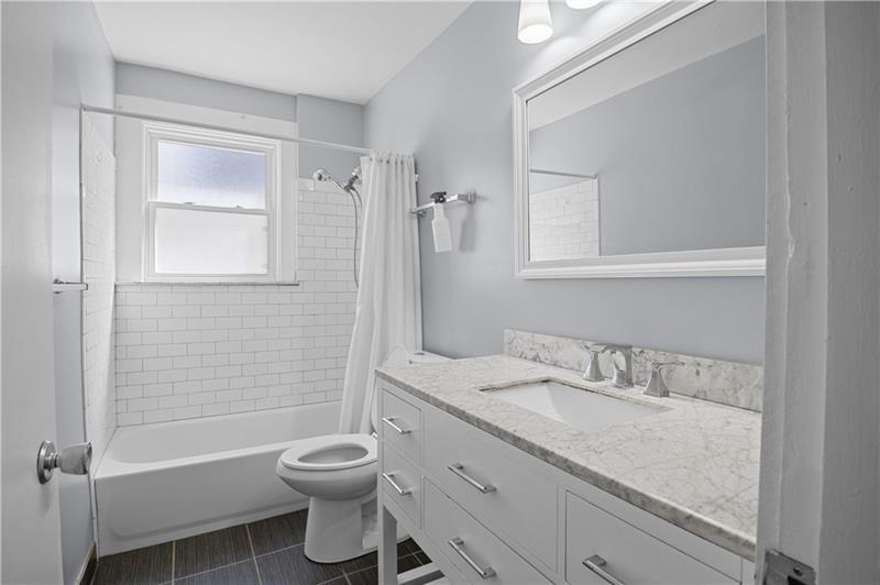 246 Dunseith Street Pittsburgh, PA 15213 - Photo 26 of 28 a bathroom with a granite countertop sink toilet and shower