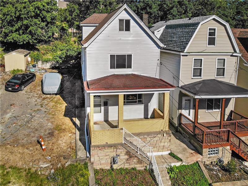 246 Dunseith Street Pittsburgh, PA 15213 - Photo 3 of 28 a front view of a house with yard porch and furniture
