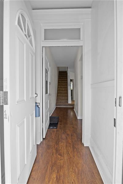 246 Dunseith Street Pittsburgh, PA 15213 - Photo 6 of 28 a view of a hallway with wooden floor and staircase