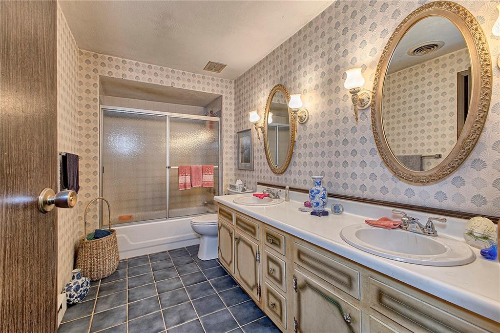 128 Raccoon Road, Unit ACME PA 15610 Acme, PA 15610 - Photo 11 of 23 a bathroom with a double vanity sink mirror and bathtub