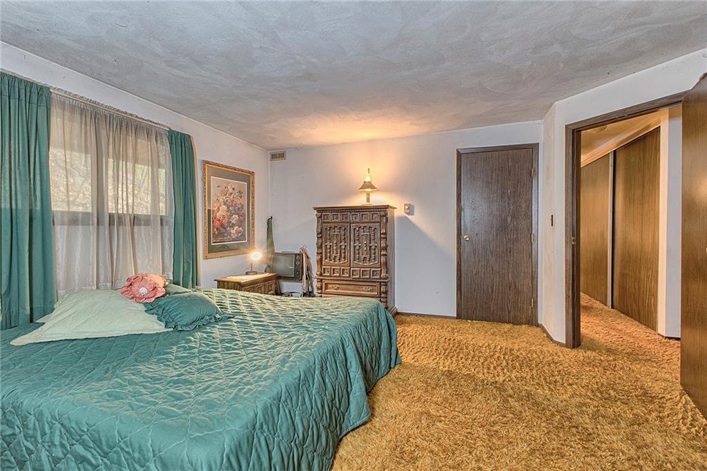 128 Raccoon Road, Unit ACME PA 15610 Acme, PA 15610 - Photo 15 of 23 a bedroom with a bed and a window