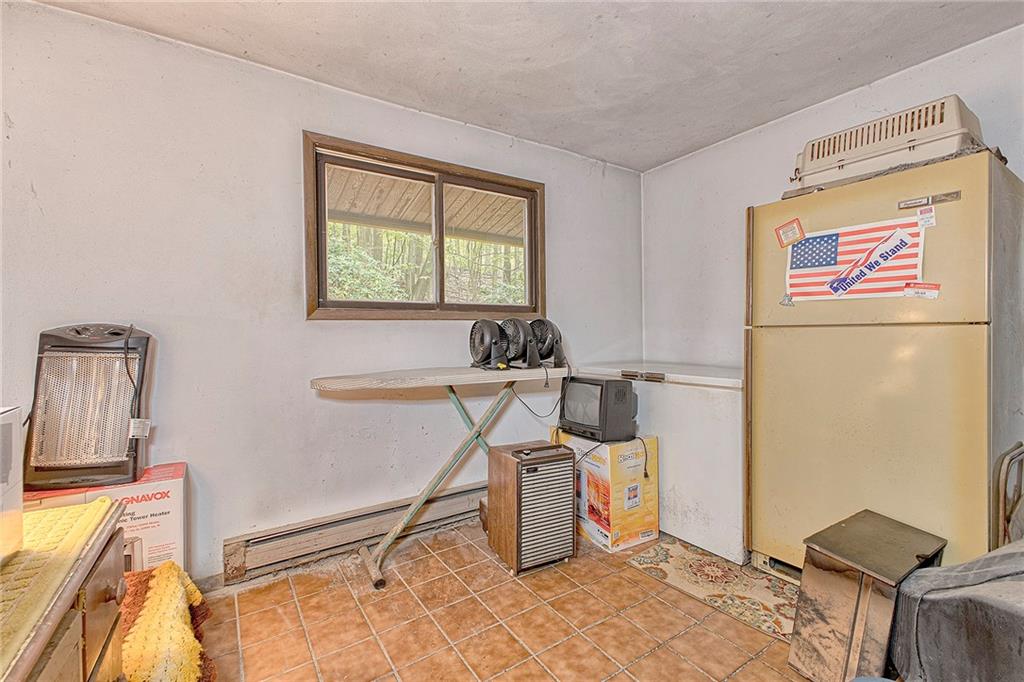 128 Raccoon Road, Unit ACME PA 15610 Acme, PA 15610 - Photo 17 of 23 a workspace with furniture and a window
