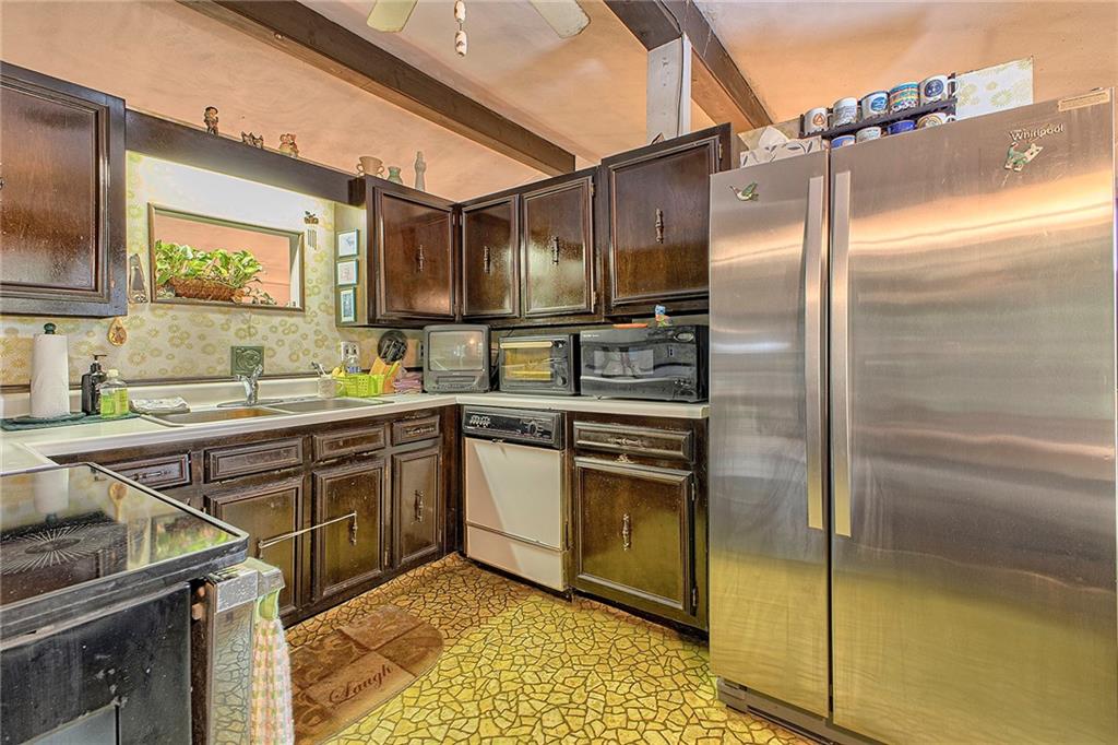 128 Raccoon Road, Unit ACME PA 15610 Acme, PA 15610 - Photo 7 of 23 a kitchen with stainless steel appliances granite countertop a sink stove and refrigerator
