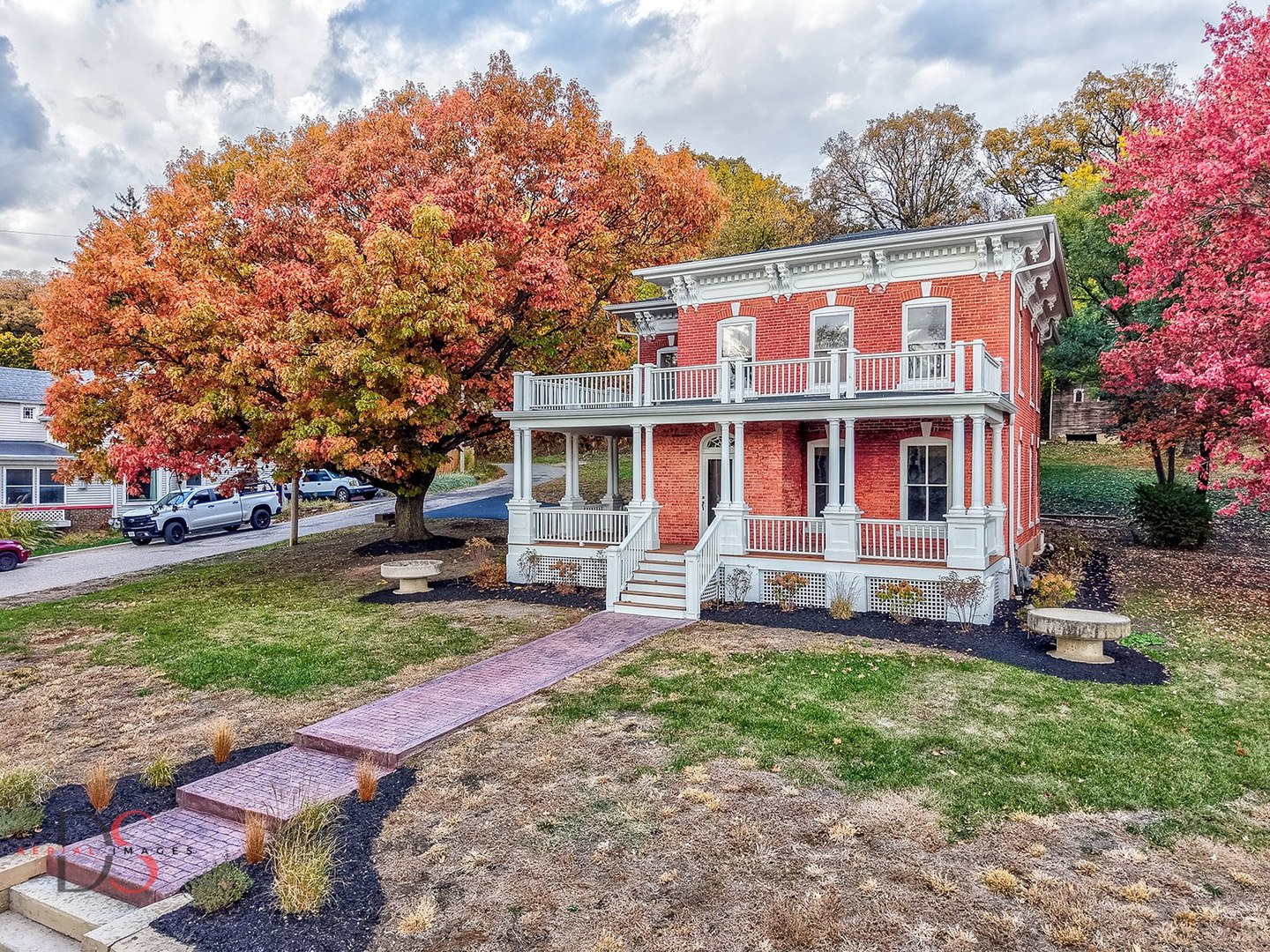 a front view of a house with a yard table and chairs