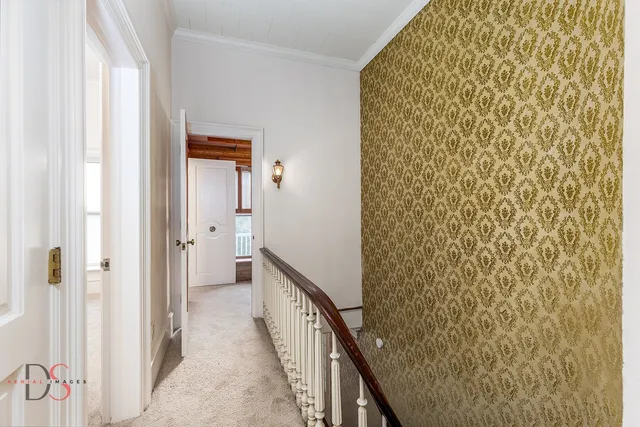 a view of a bathroom from a hallway