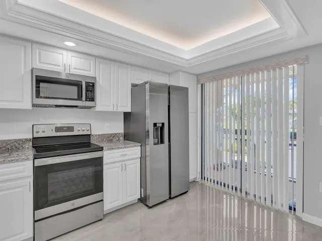 a kitchen with a stove microwave and refrigerator